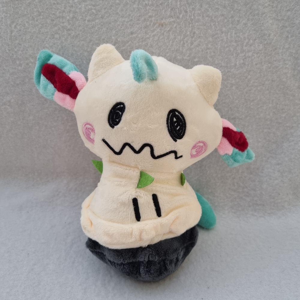 Cream and Black Stuffed Animal Toy